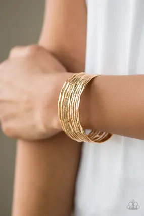 Elegant Gold Cuff Bracelet with Sleek Shimmer - Paparazzi Bracelet